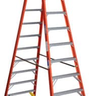 A 10-foot Werner fiberglass twin stepladder, Type 1A, designed for robust commercial and industrial scaffolding, providing superior safety and stability for elevated work.