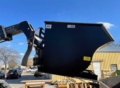 Heavy duty self-dump hopper in use on construction site showing waste disposal